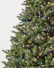 Closeup of artificial Christmas tree with multicolored LED lights