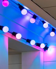 Multicolored light string on a roof gutter