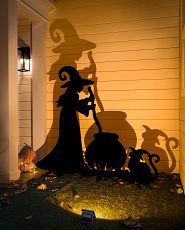Lit Halloween silhouettes of witch with cauldron and cat