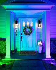 House façade lit with colored floodlights